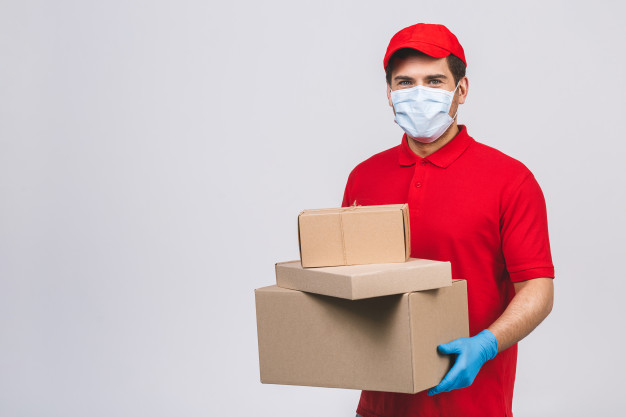 delivery-man-employee-red-cap-blank-t-shirt-uniform-face-mask-gloves-hold-empty-cardboard-box-isolated-white-wall-service-q.jpg